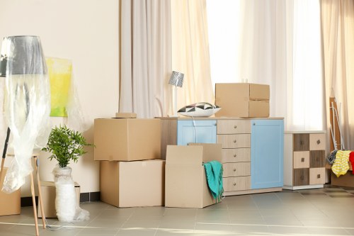 Office relocation planning in Queens Park with packed boxes and office furniture