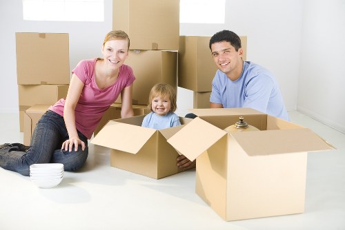 Loading furniture and boxes into a removals van for a local Queens Park move