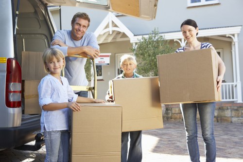 Local business movers handling desks and equipment during an office move