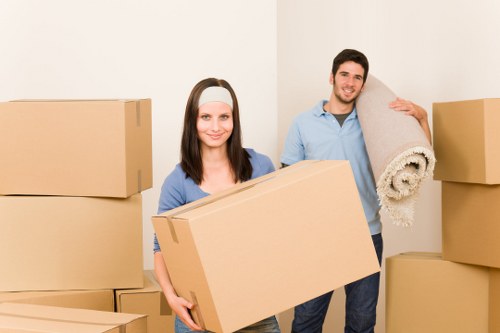 Moving team navigating stairs and access in a Queens Park property
