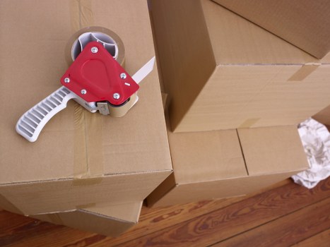 Preparing boxes and furniture for a local move in Queens Park