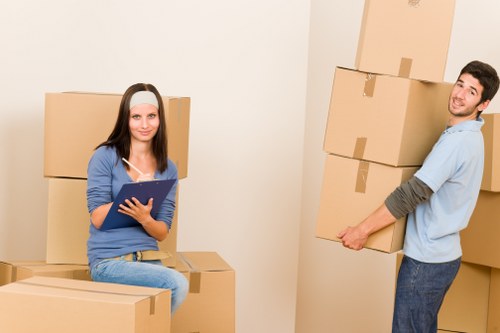 Business equipment and office furniture arranged for transport in a removals van
